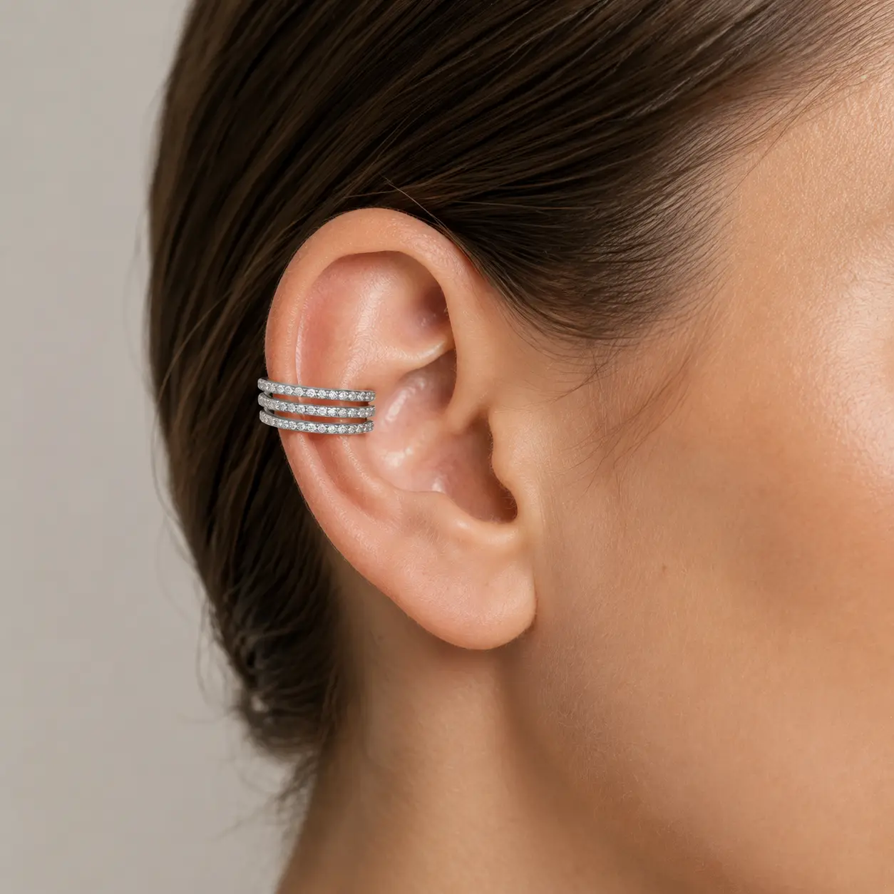 The Trois Pavé Ear Cuff worn on model in white gold